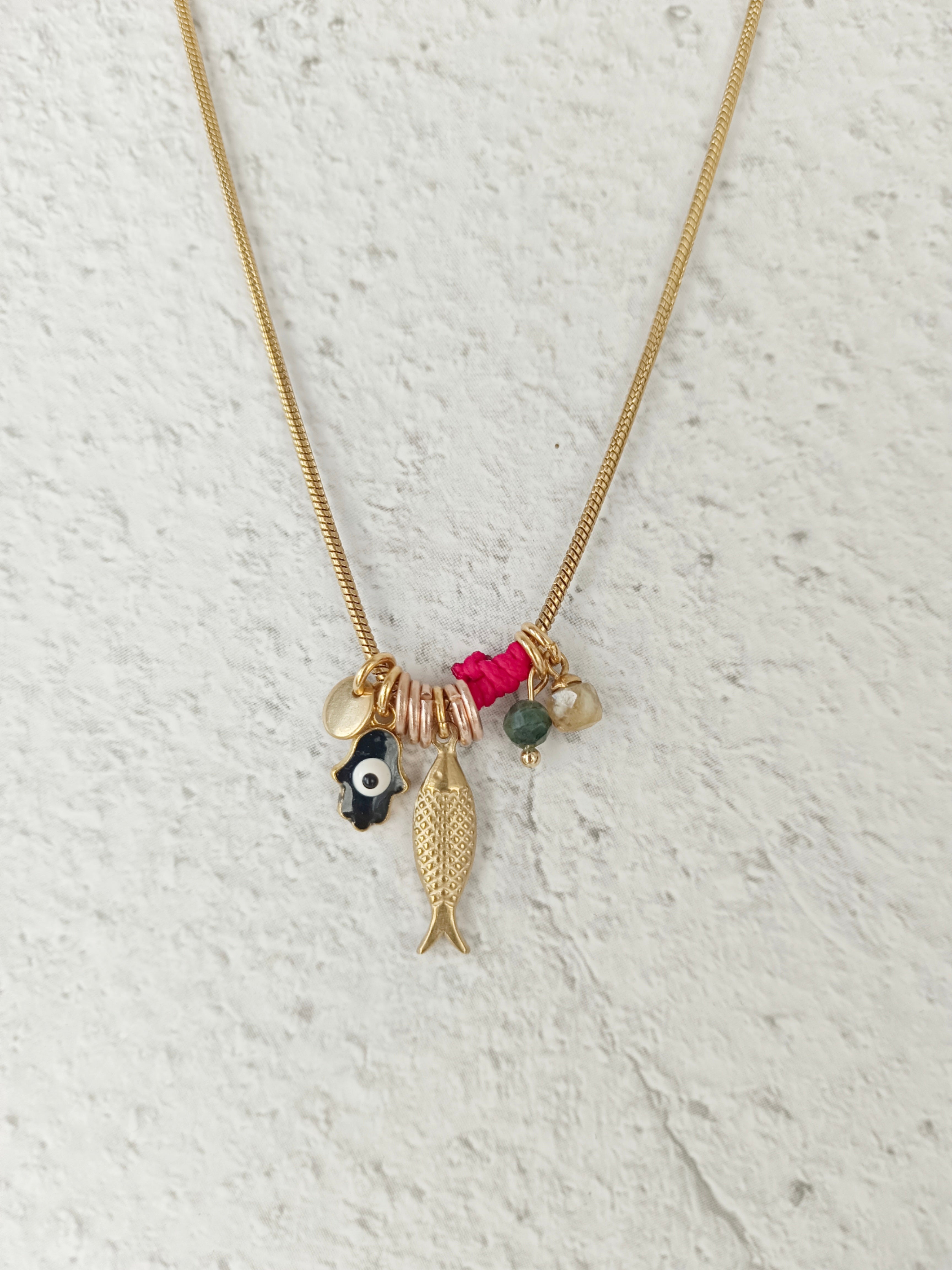 my eyes A rounded snake necklace with gold plating combined with pendants of blessing and protection
