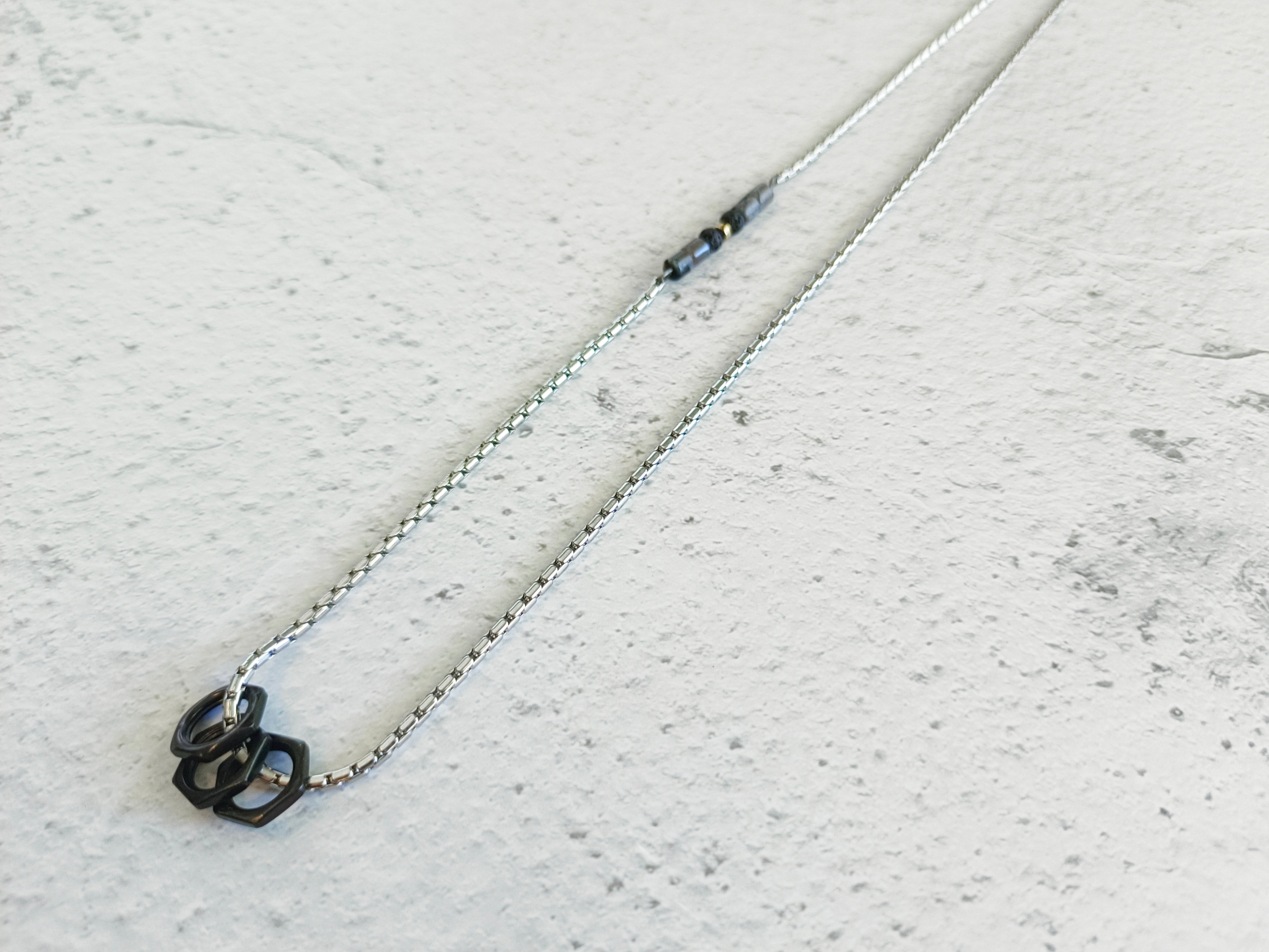 Holidays Rounded stainless steel necklace combined with stones and geometric elements